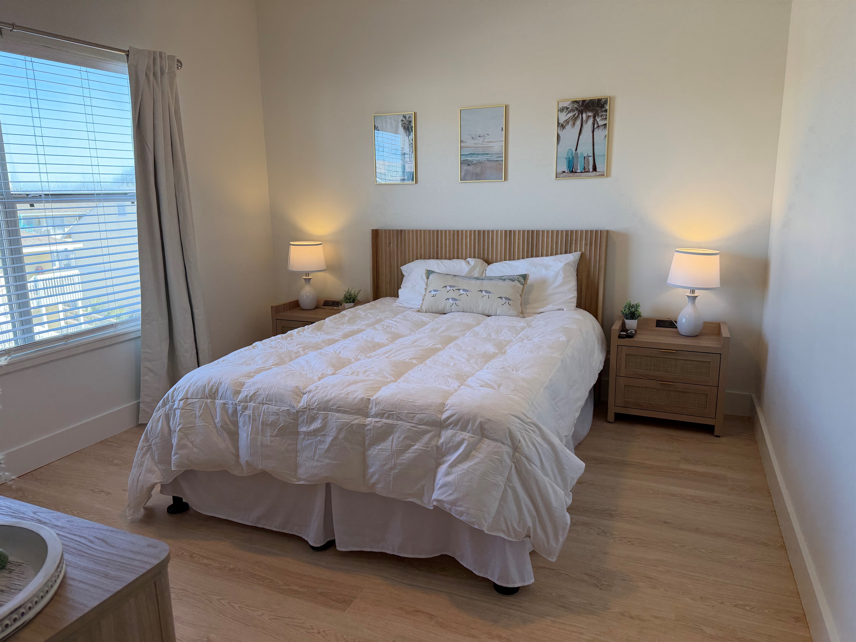 Guest bedroom with nightstands that have build-in charging capability for your Apple devices and plenty of storage room!