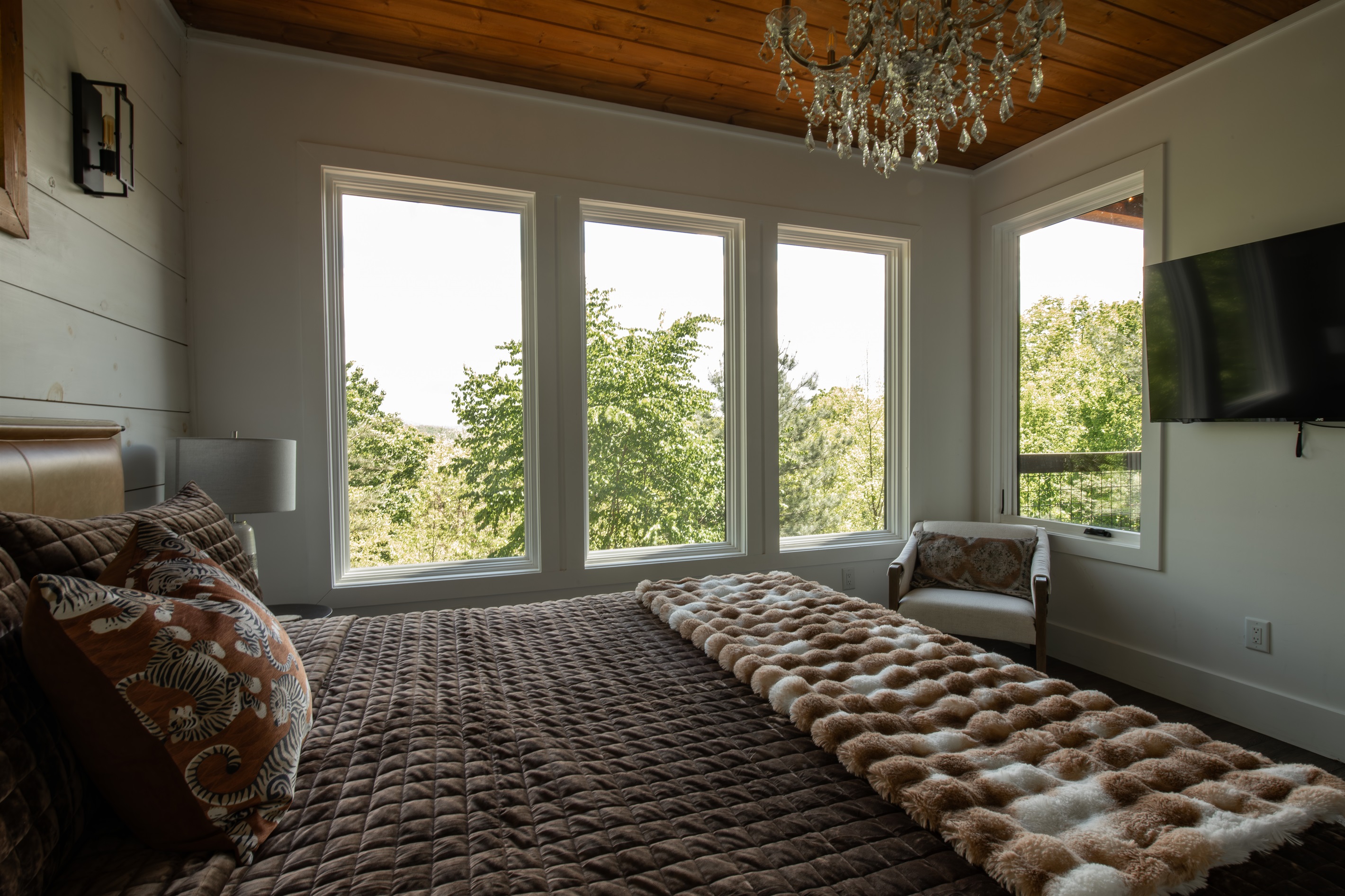 King Suite 3 | Wall-to-wall windows with soft natural light and layered views