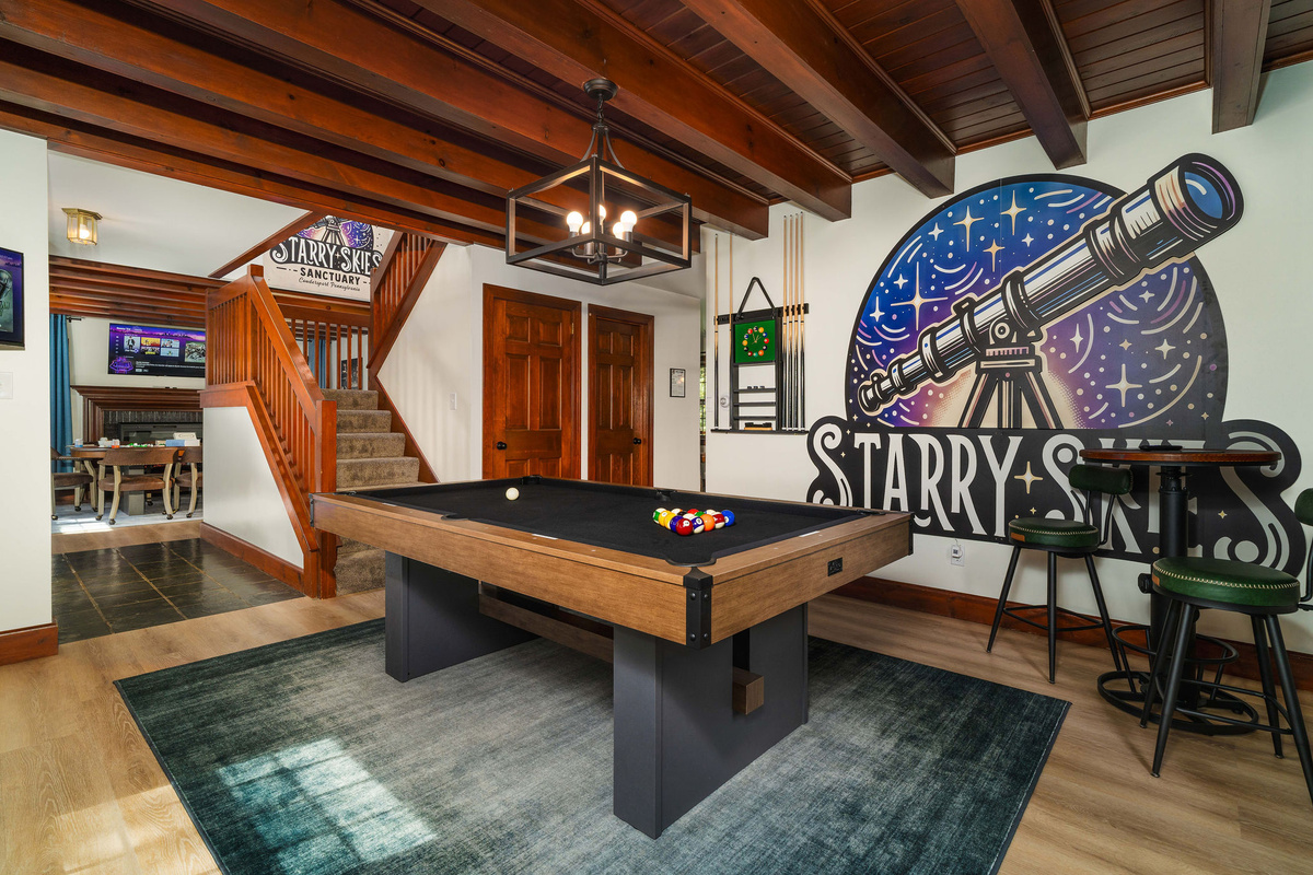 🎱 The billiards room, under the original beamed ceiling — with our hand-painted Starry Skies mural.