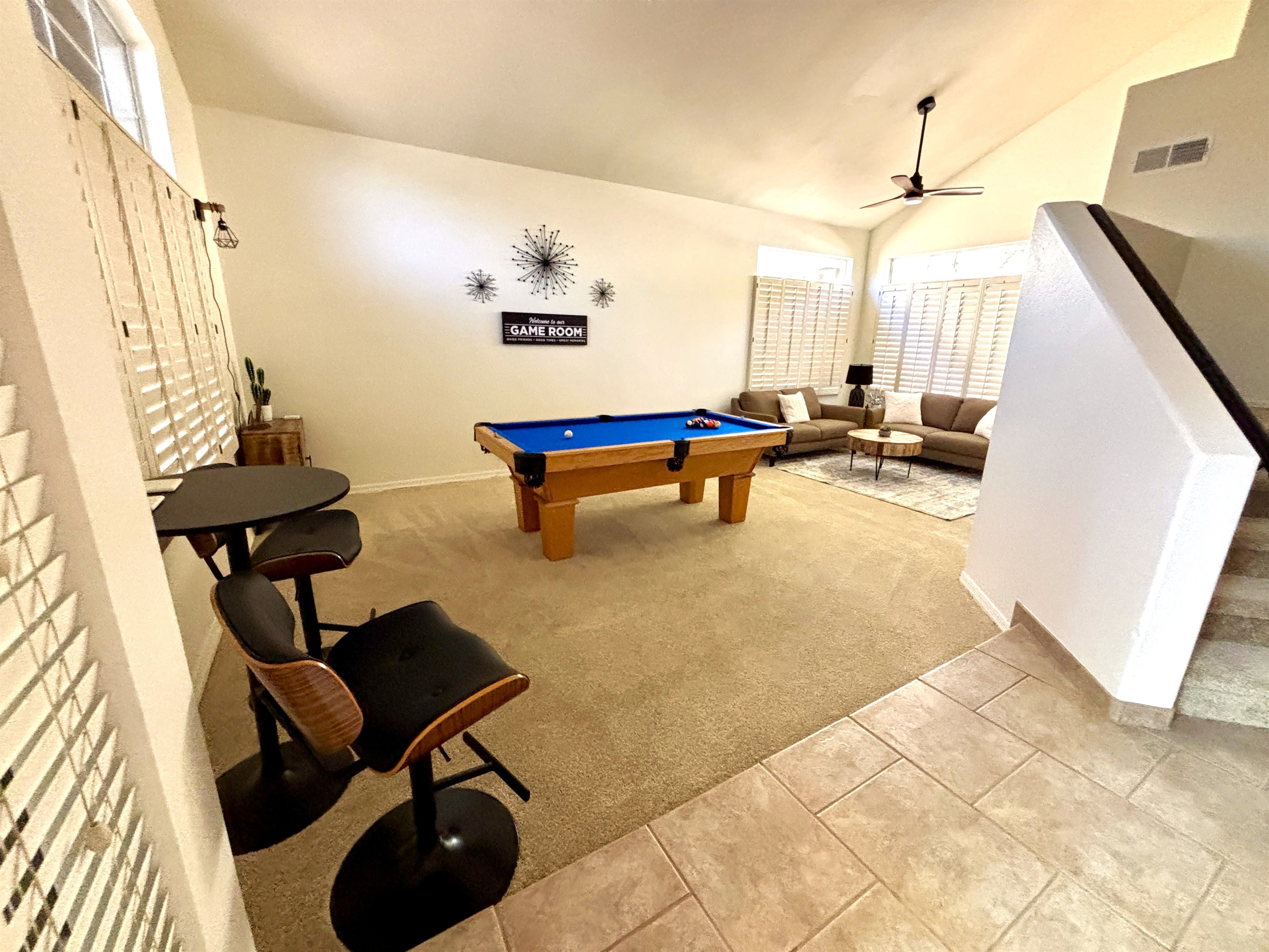 Game room with lounge area, pub seating, pool table, board games for the whole family