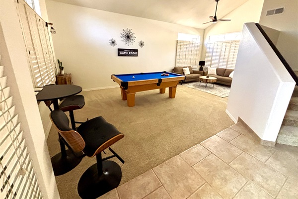 Game room with lounge area, pub seating, pool table, board games for the whole family