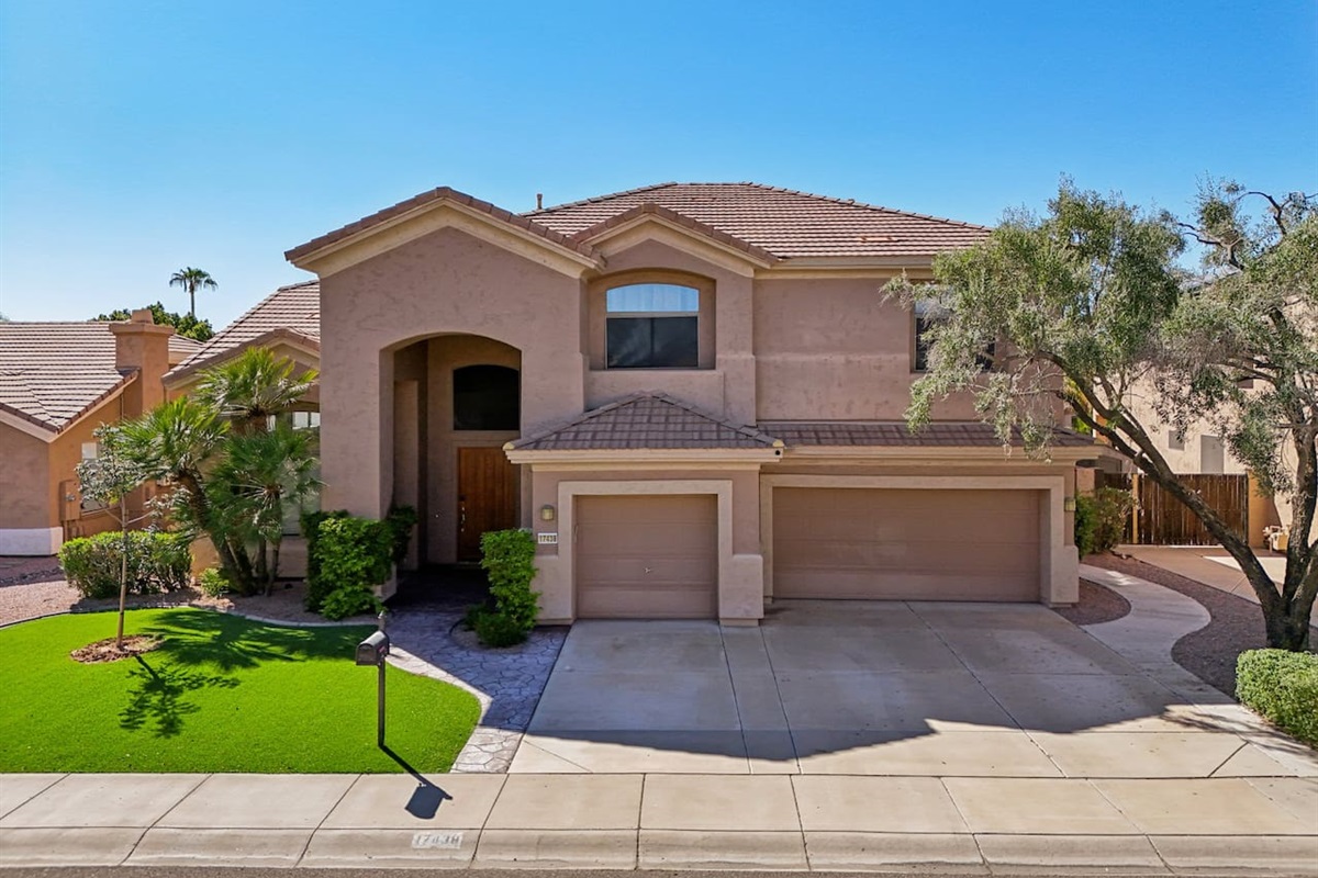 Arrive in style! Beautiful façade with a large entryway, manicured lawn, and a wide driveway—ample parking for the whole group.