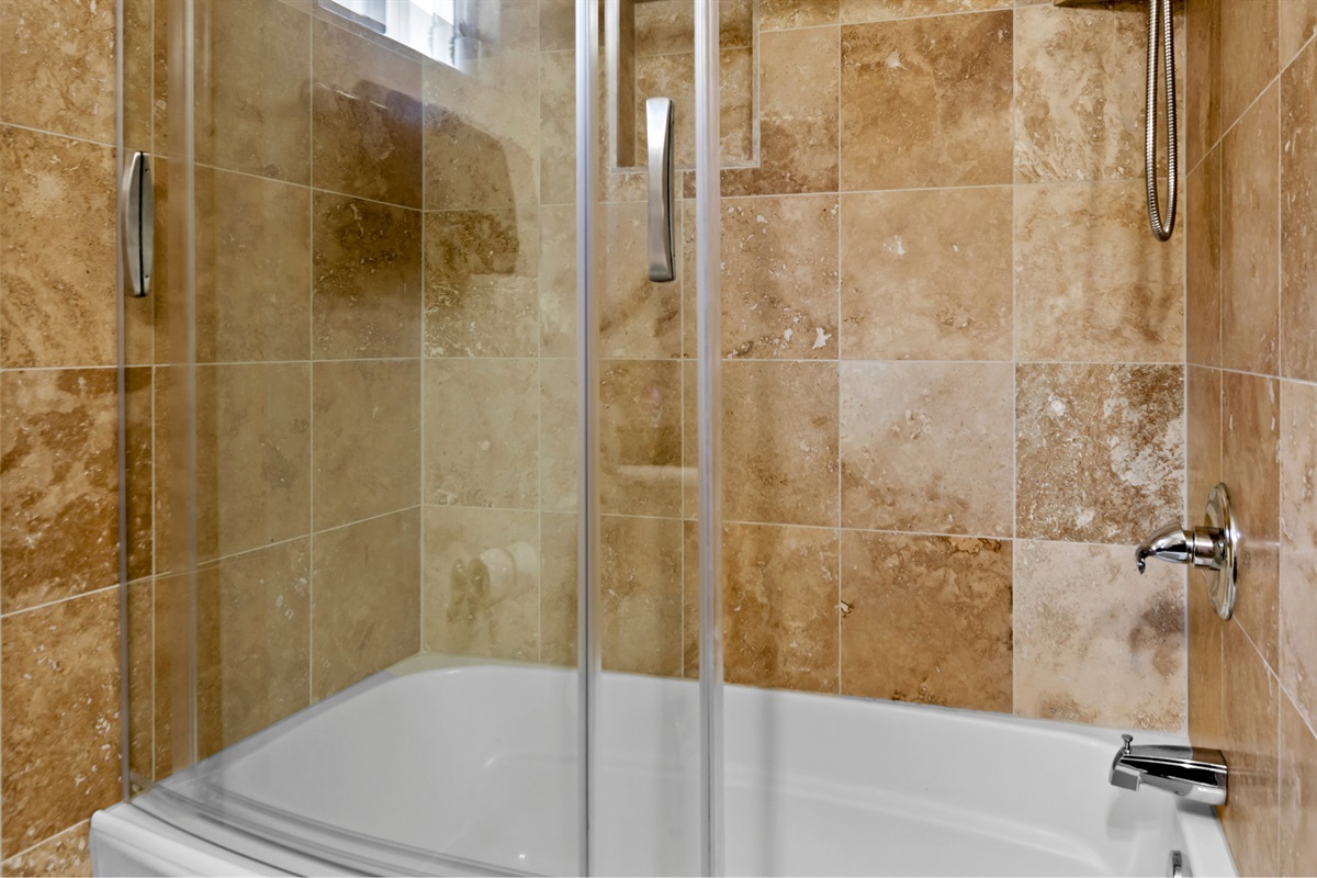 Refresh yourself in the shared upstairs bathroom, featuring a stylish shower designed for comfort and convenience.