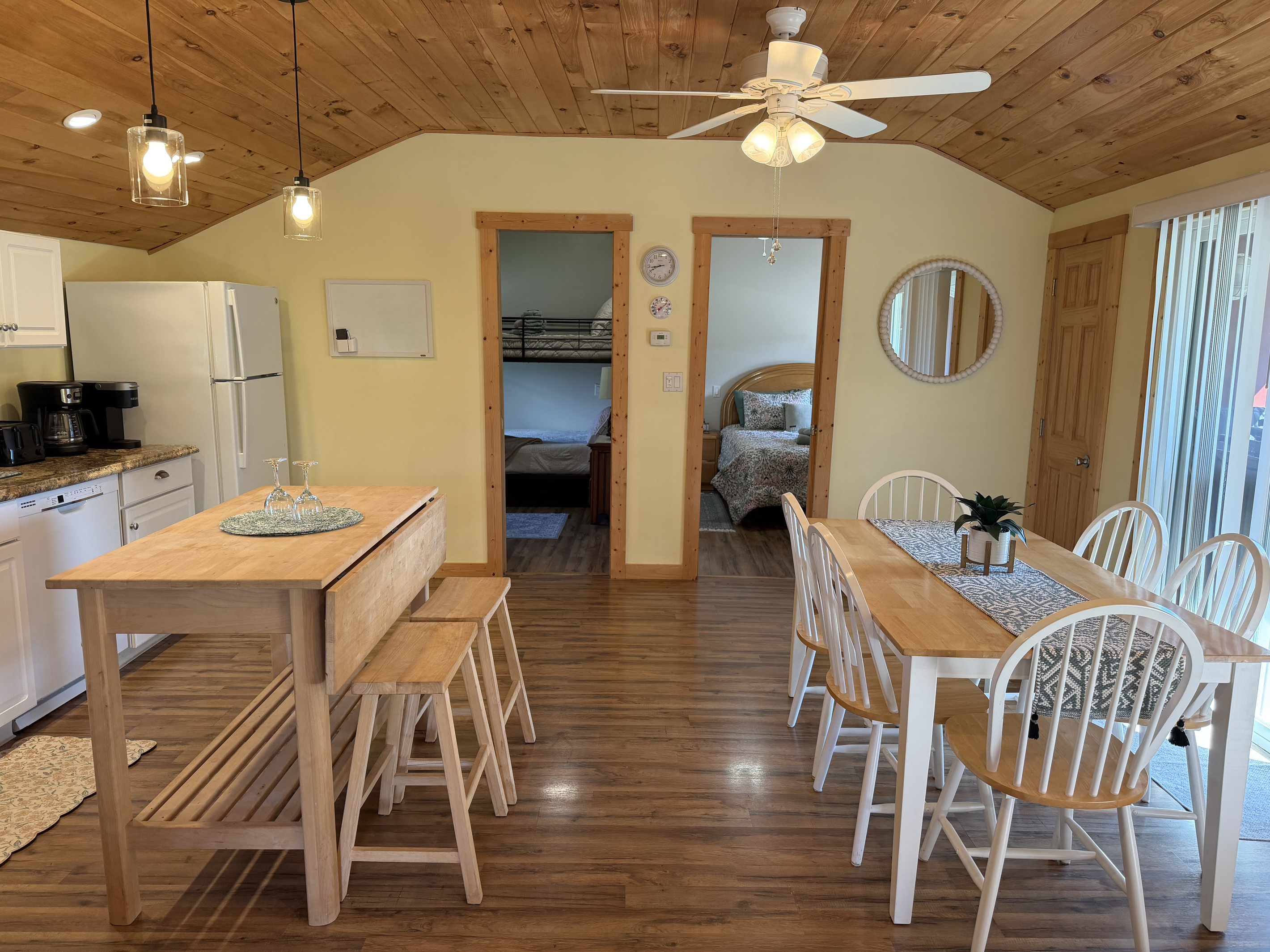 Dining and kitchen with bedrooms beyond