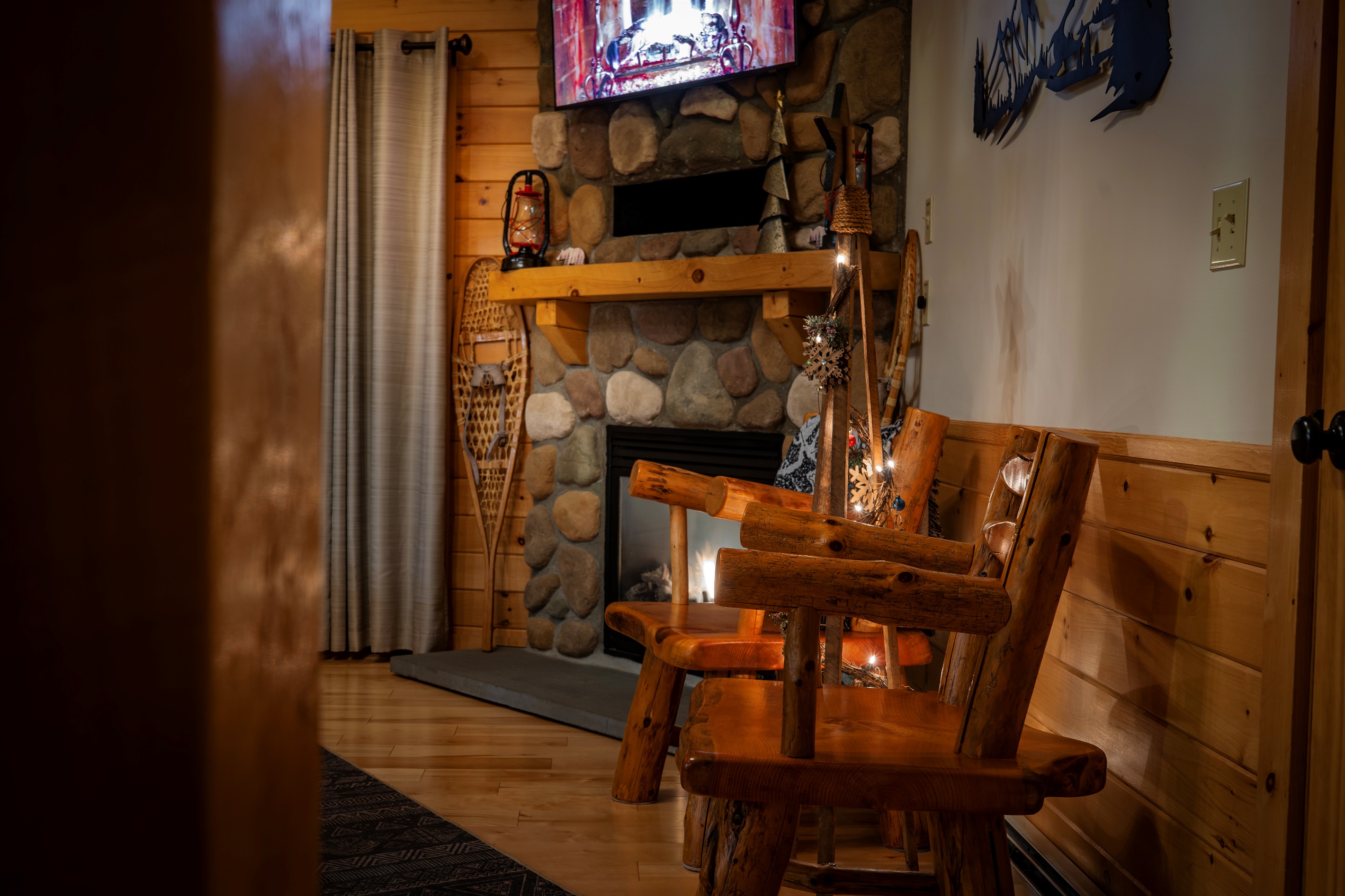 Find comfort and relaxation in the elegant living room with a radiant fireplace.