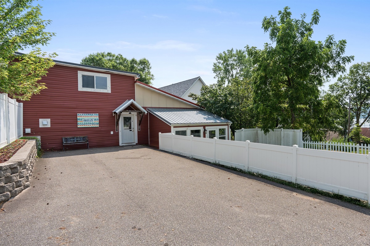 The entrance and parking area, which fits 2-4 cars, or 2 trucks. There's plenty more street parking in front of the building. Ask us about where to park your boat just down the street!