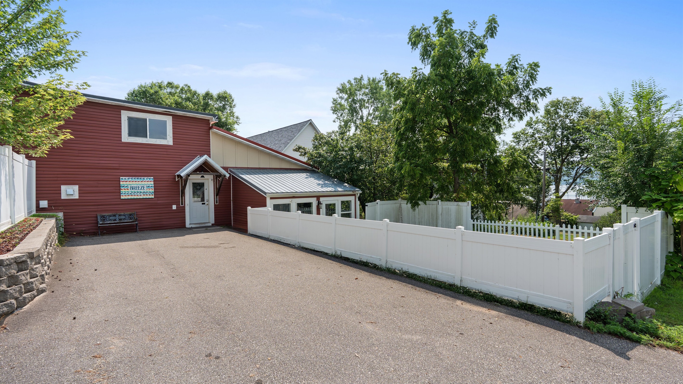 The entrance and parking area, which fits 2-4 cars, or 2 trucks. There's plenty more street parking in front of the building. Ask us about where to park your boat just down the street!