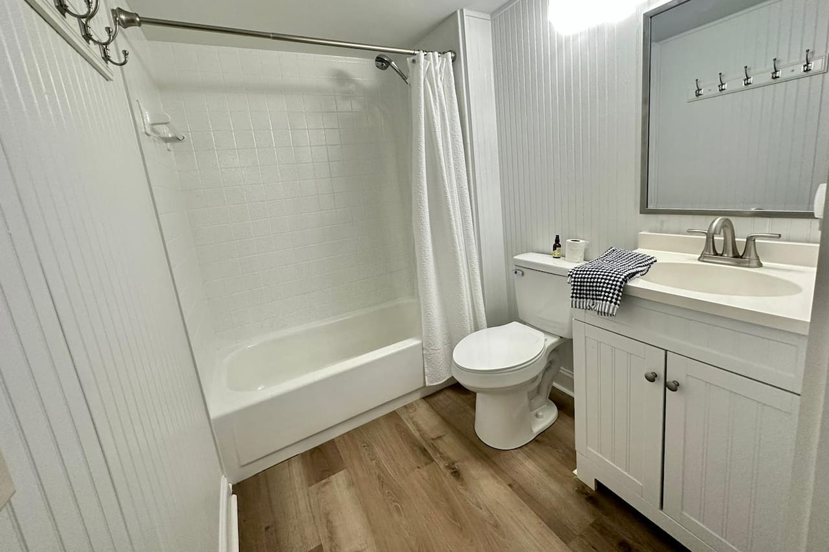 Bathroom with tub and shower