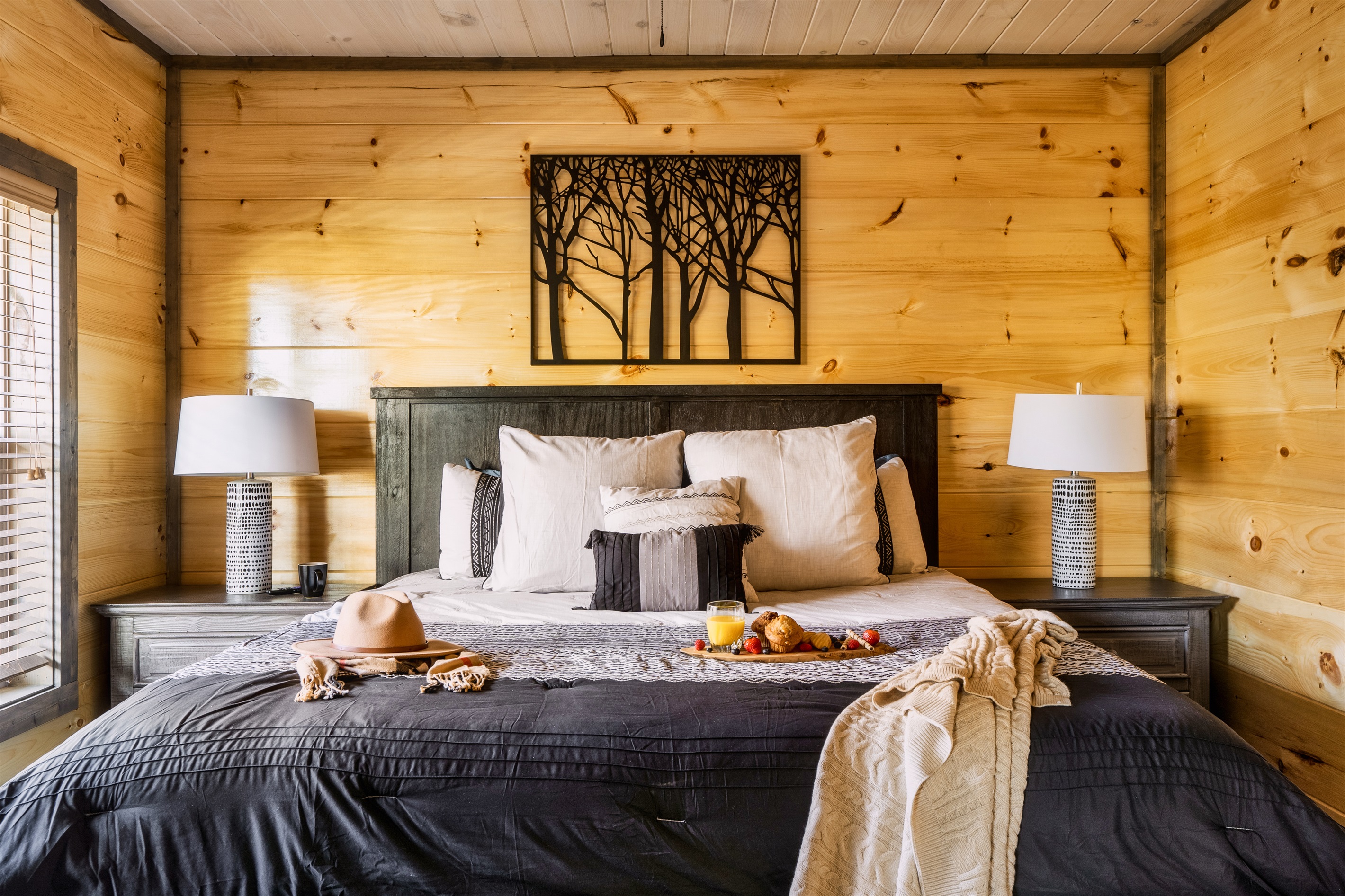 Snuggle up in bed overlooking the woods after a long day of sightseeing