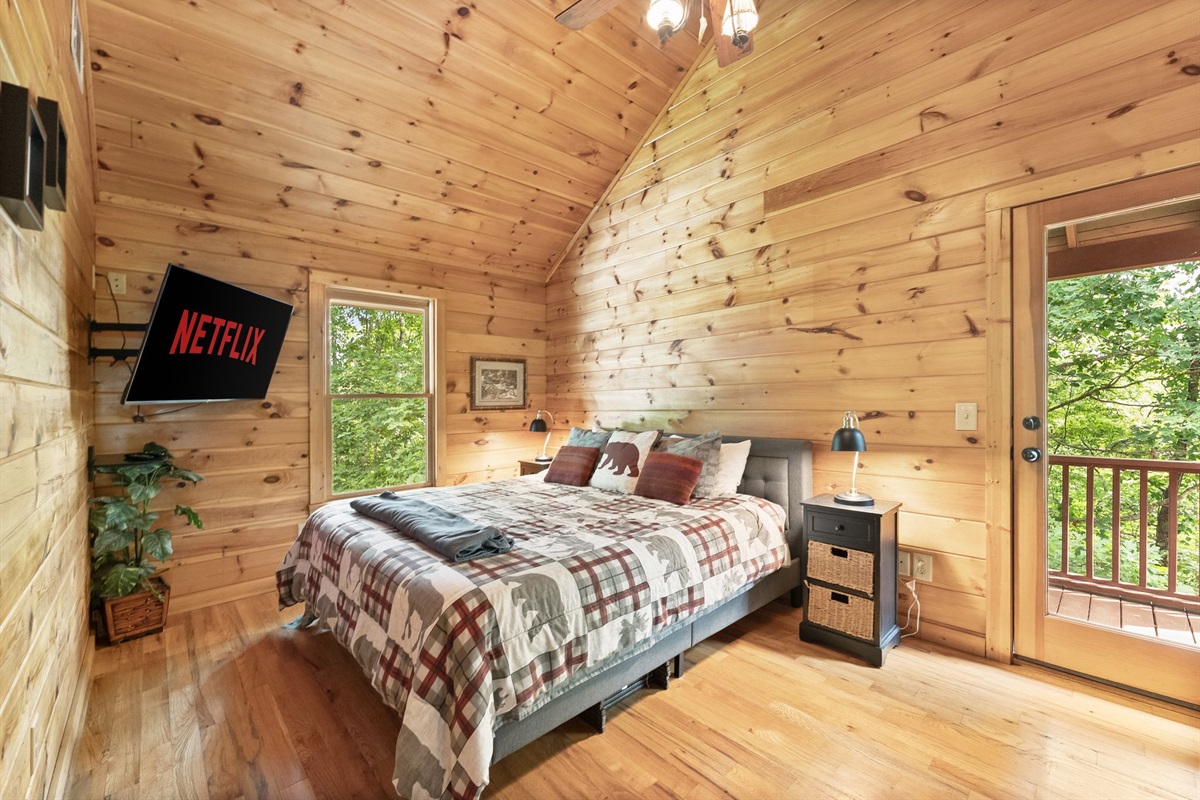 Private upstairs bedroom featuring a cozy full-size bed and peaceful cabin comfort for a restful stay.