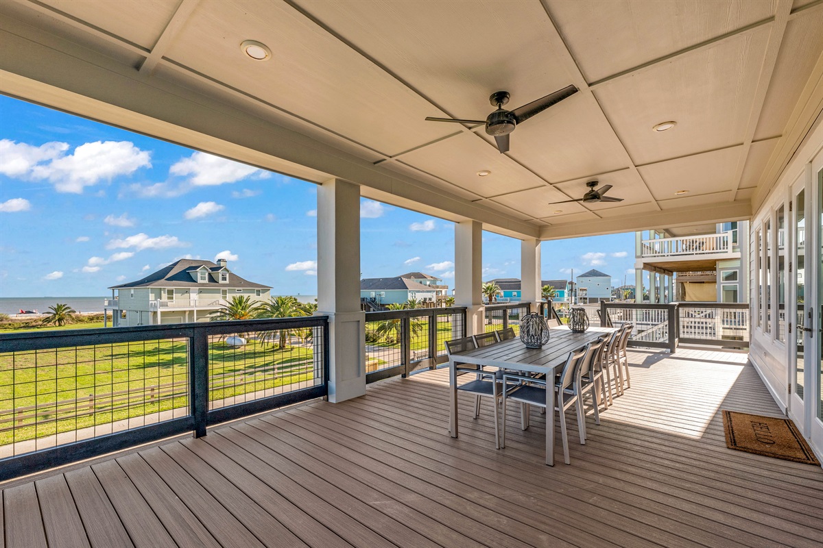 Costa Cristal Outdoor Space: This expansive, well-lit balcony is perfect for lounging or entertaining. Overlooking the beach and neighboring homes, it offers a seamless blend of outdoor living and stunning coastal vistas.