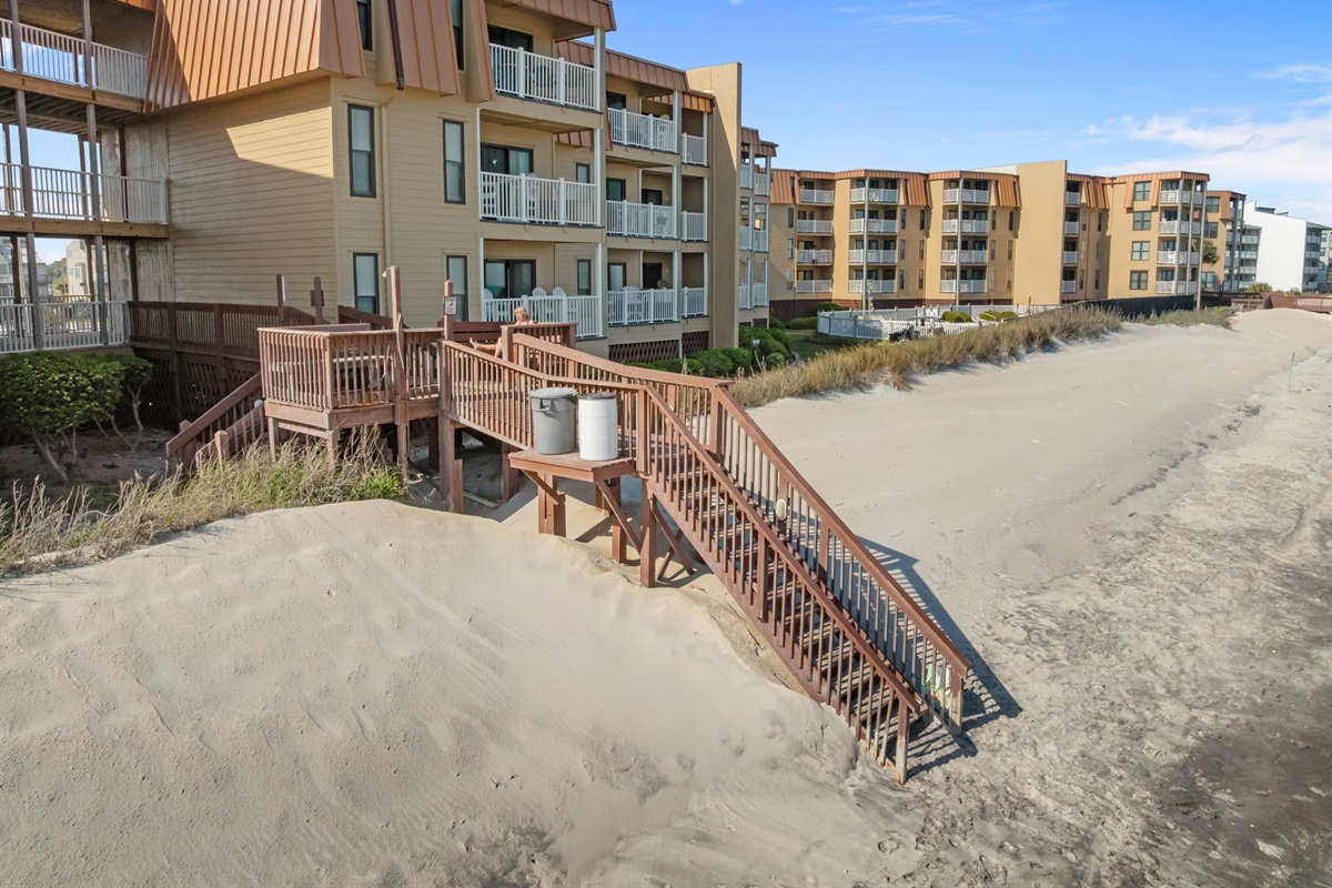 Direct private beach access with stairs leading straight from the dunes to the sand
