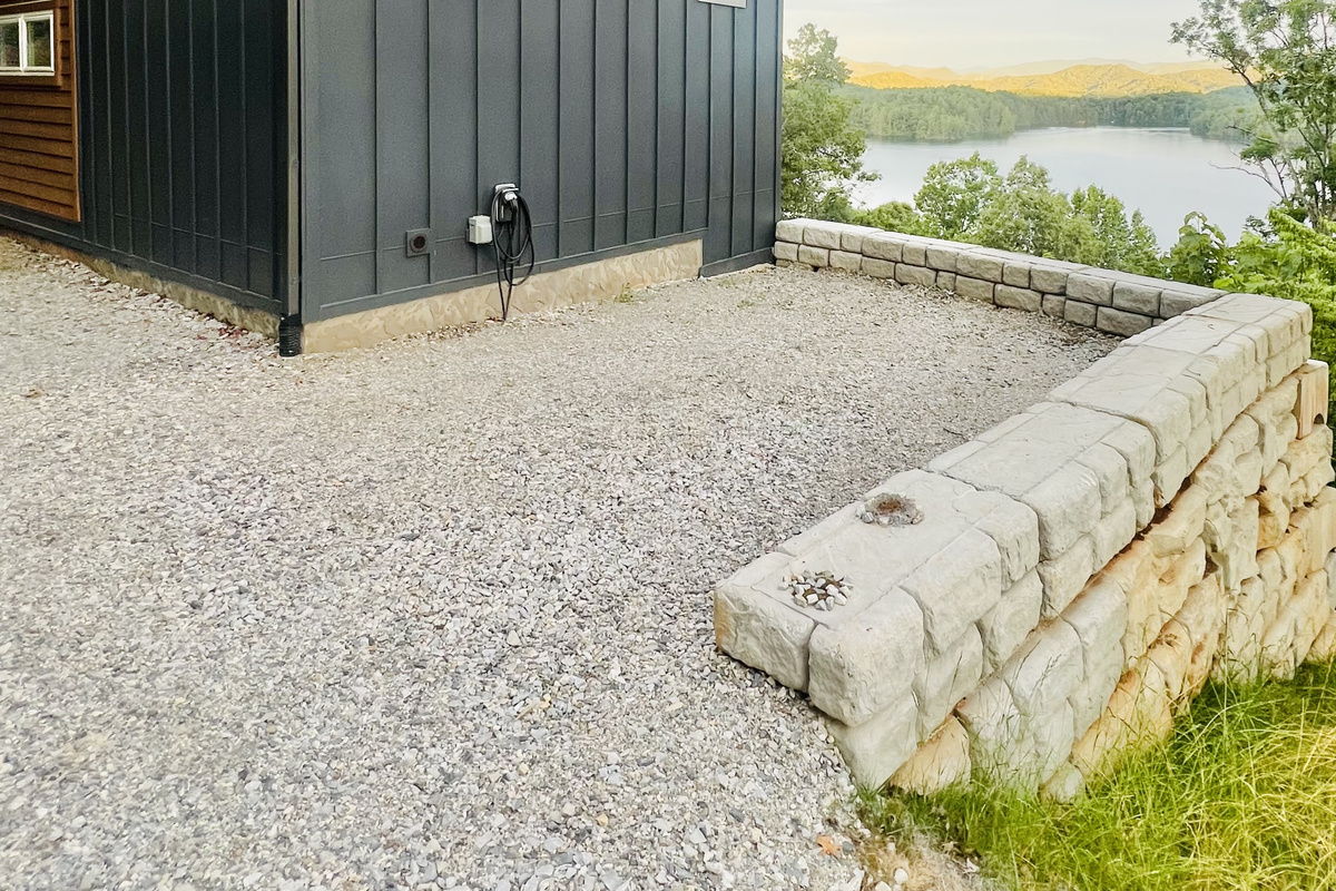 Modern mountain design meets lake living.
Hidden Point House welcomes you with contemporary architecture, convenient parking, and glimpses of Lake Santeetlah before you even step inside.