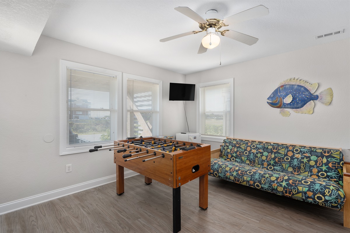 Fun game room setup with comfy seating for everyone.