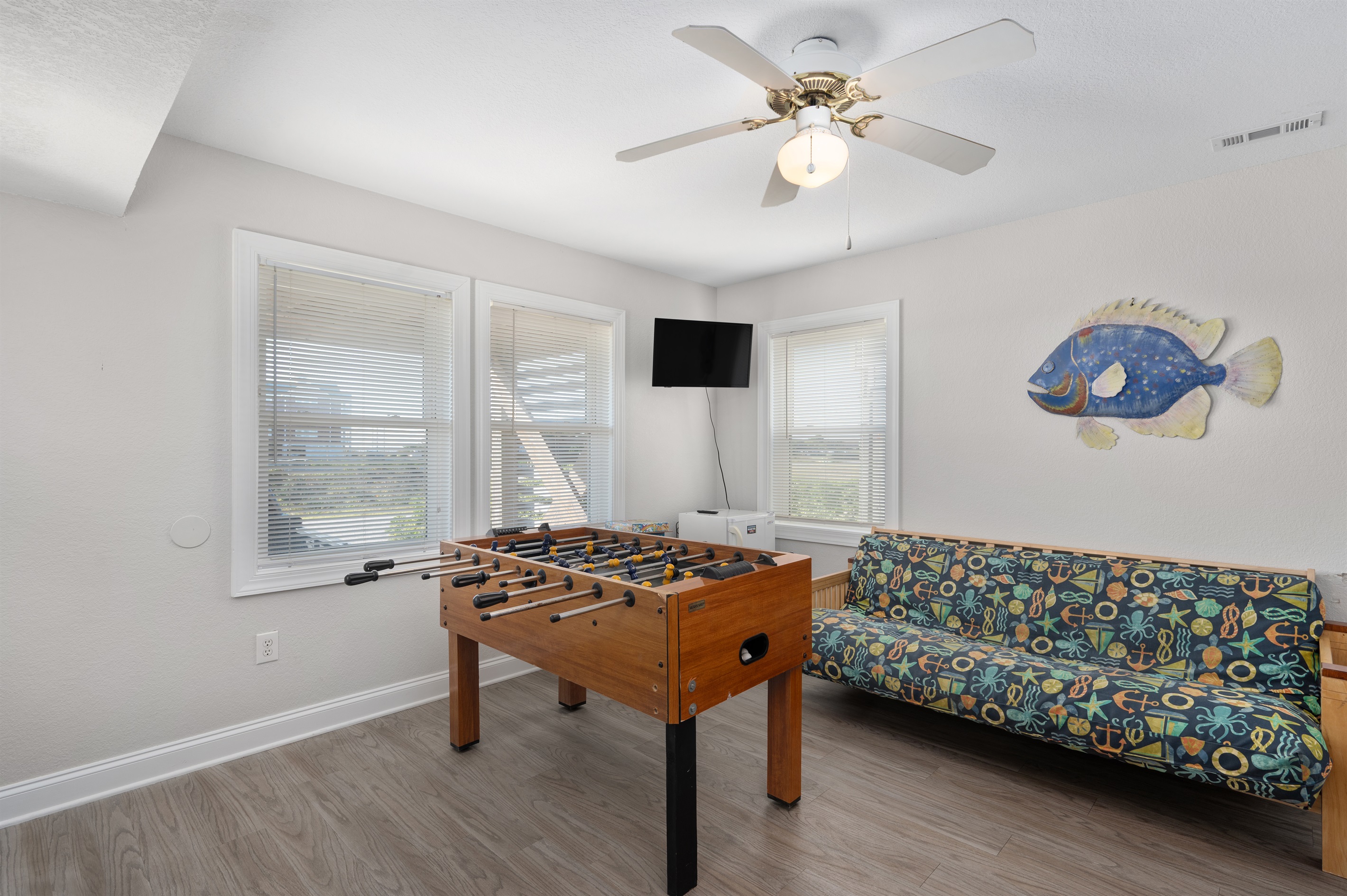 Fun game room setup with comfy seating for everyone.