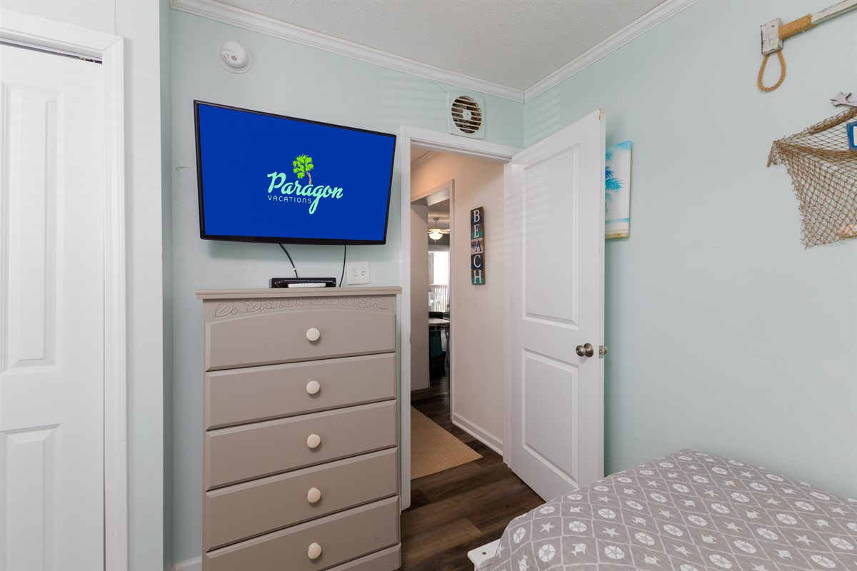 TV and dresser in the second bedroom