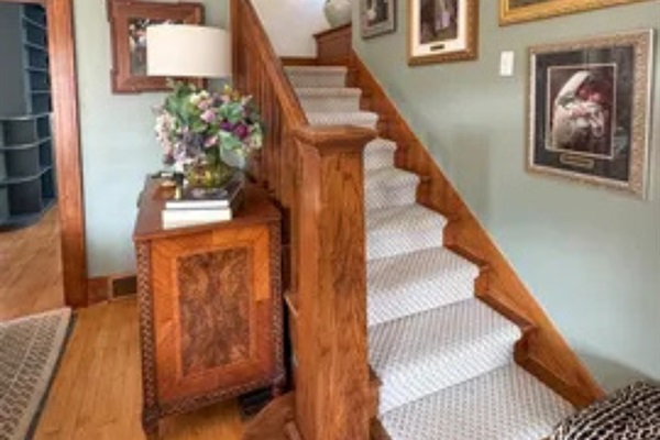 From the staircase to the wood accents, the entry has a classic and comfortable feel.