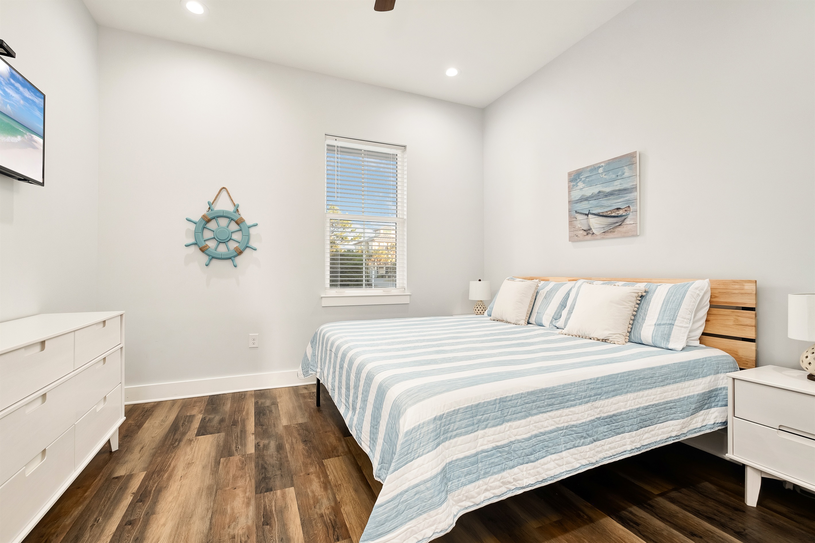 Bedroom #2 is a luxurious retreat with a king-size bed, a walk-in closet, and an ensuite bathroom with a tub and shower. You’ll feel pampered and relaxed in this elegant space.