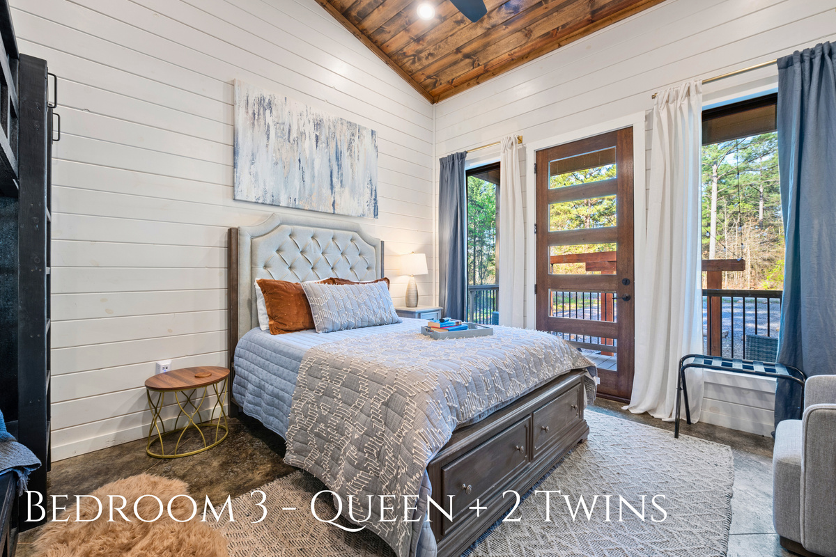This welcoming bedroom offers a comfortable queen bed along with two twin beds, making it a great option for families or friends traveling together.