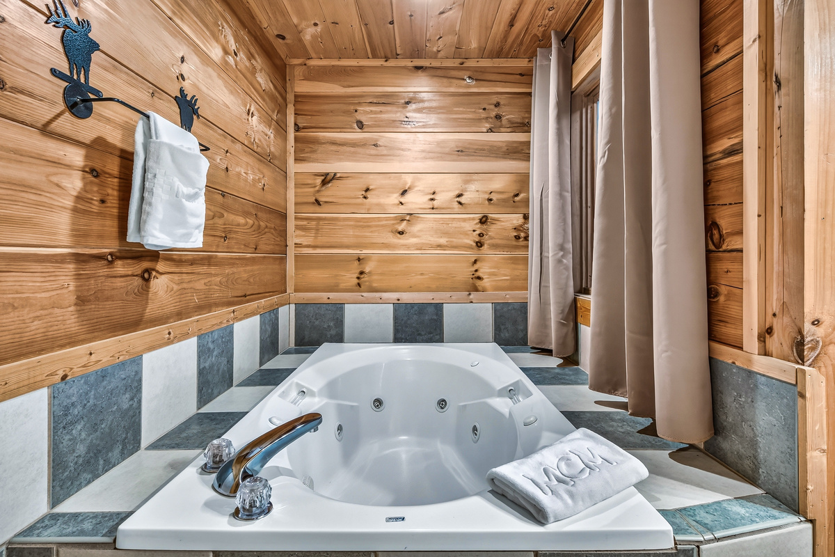 Treat yourself to a private, spa-like escape with a soothing bath surrounded by rustic charm.