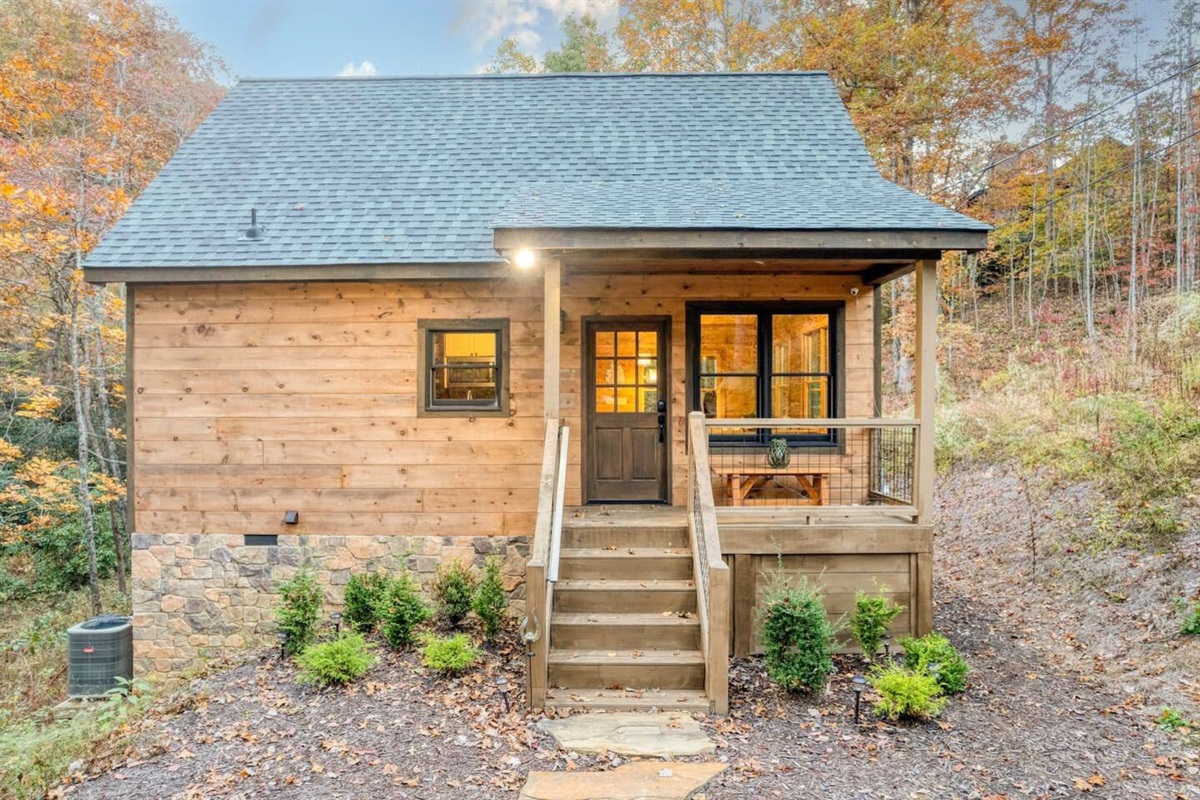 Charming cabin exterior, nature's embrace in sight