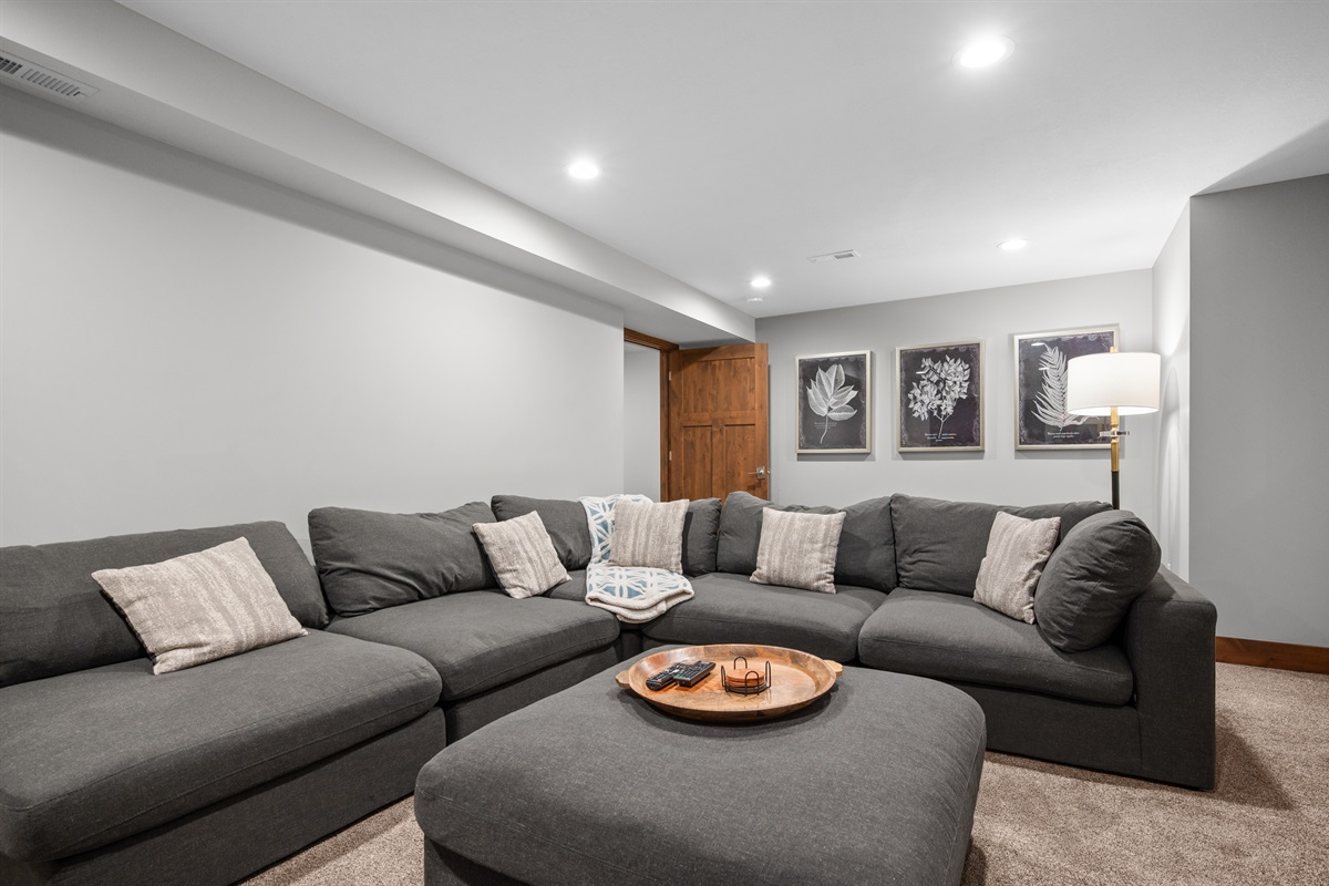 Large lower-level living area with comfortable seating