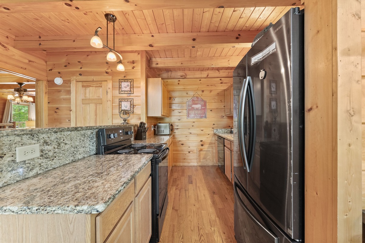 Elegant granite countertops adding a touch of luxury to the rustic interior.
