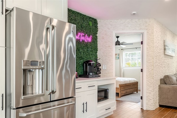 Large countertops, stainless steel appliances,  and a fully stocked coffee bar make this kitchen a great place to cook dinner, then wake up and enjoy breakfast with your family! 