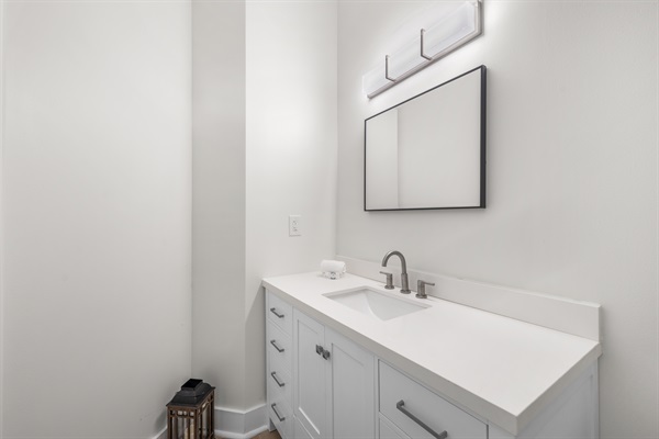 Half bath located directly near the pool for your convenience.