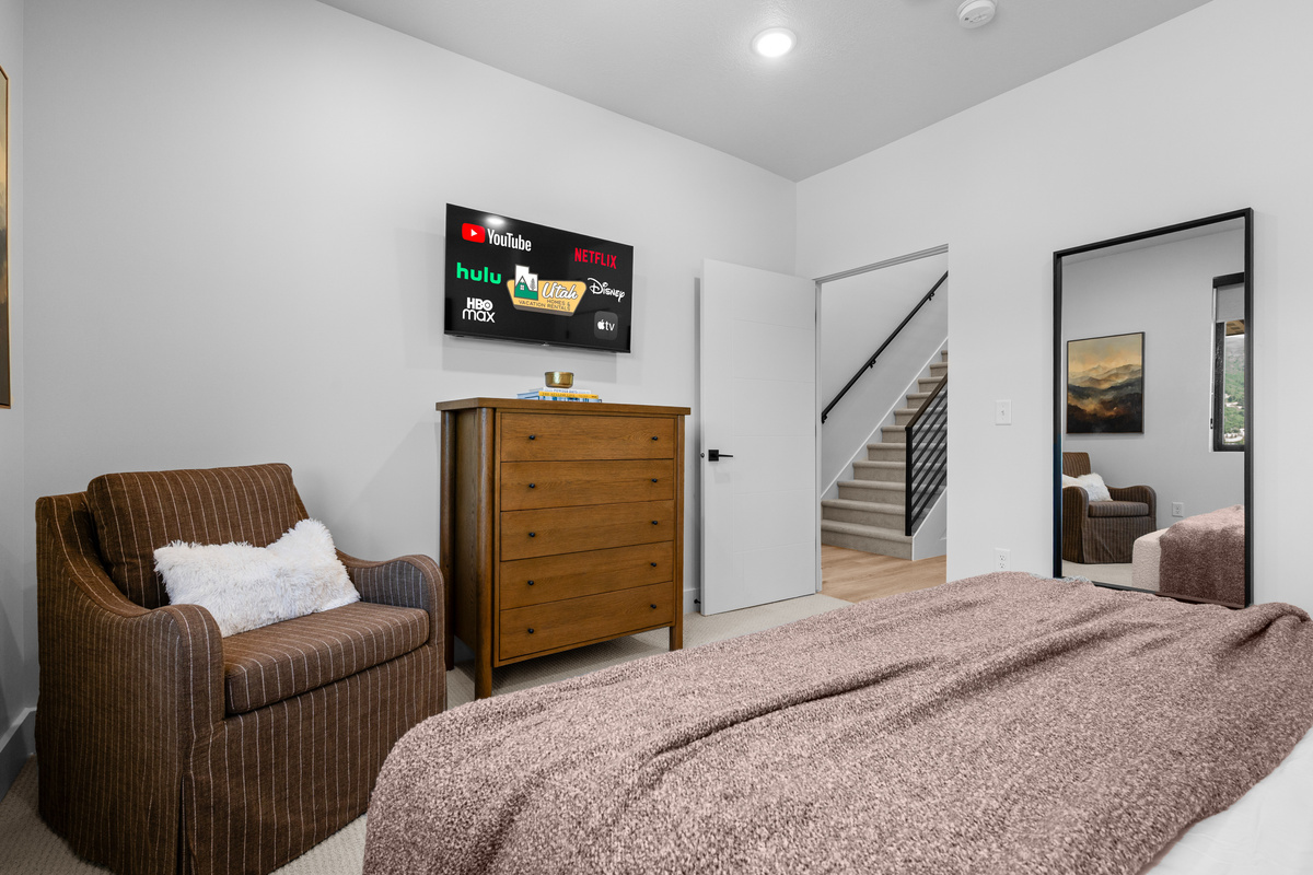 Soft bedding and inviting finishes create a relaxing retreat.
