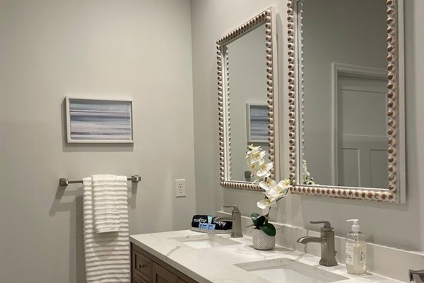 Updated master bath with double vanity and large tile shower