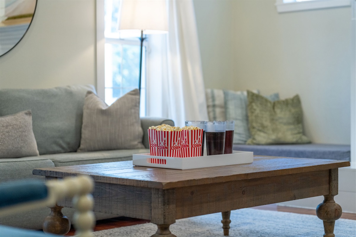 A serene atmosphere fills this living room, with soft gray walls and natural textures enhancing its calming appeal.