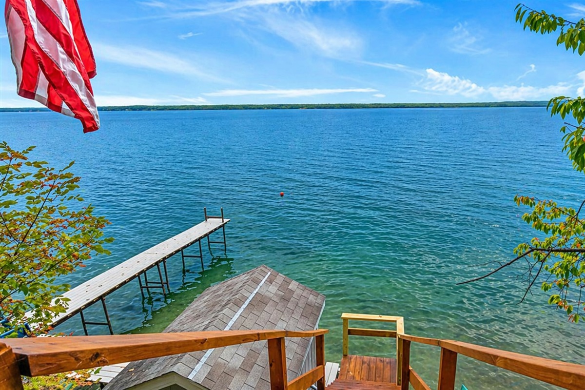 Enjoy direct access to the water from this private dock. Ideal for fishing, boating, or simply soaking in the peaceful lake views, this dock is your gateway to lakeside fun. 