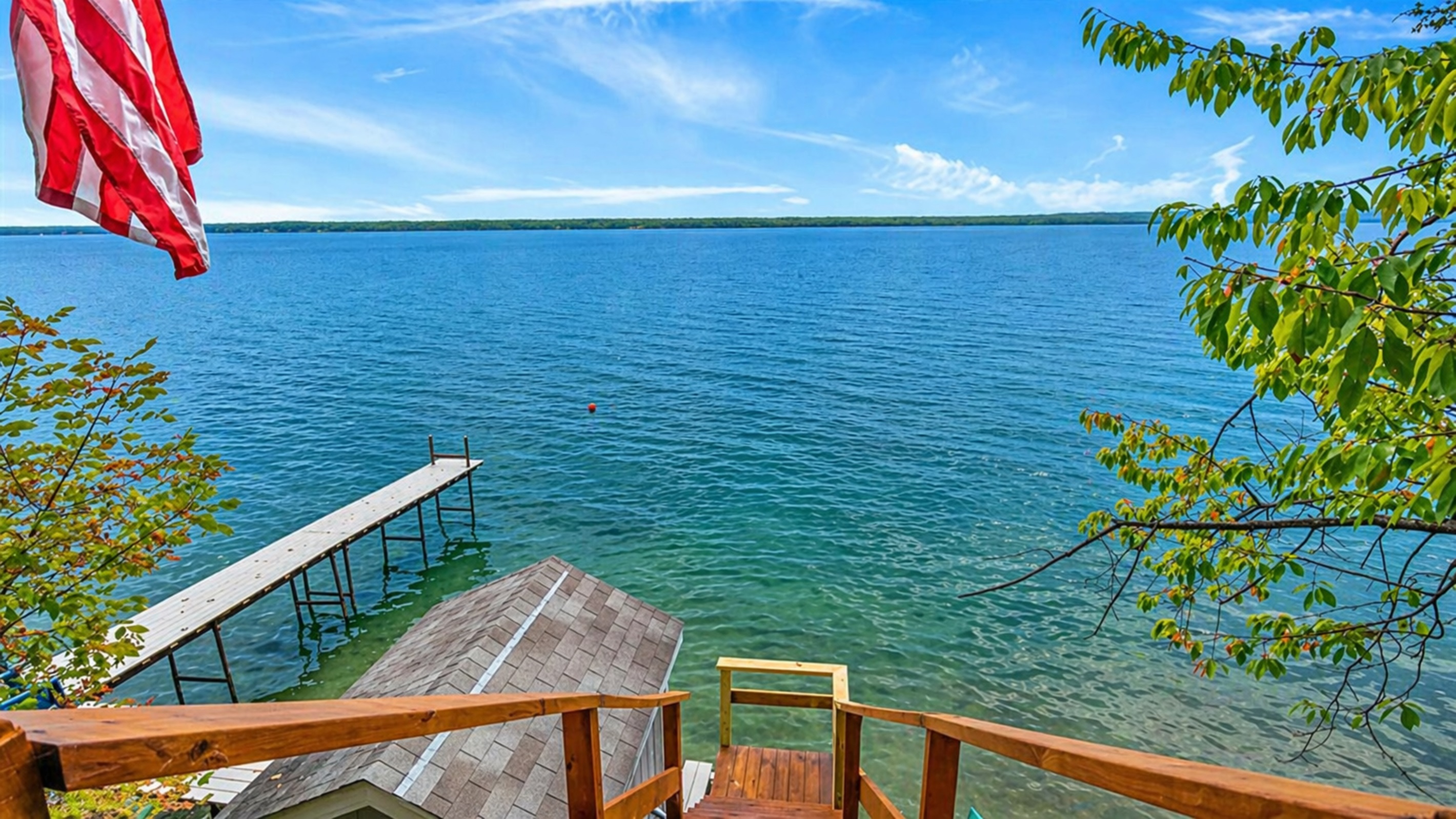 Enjoy direct access to the water from this private dock. Ideal for fishing, boating, or simply soaking in the peaceful lake views, this dock is your gateway to lakeside fun. 