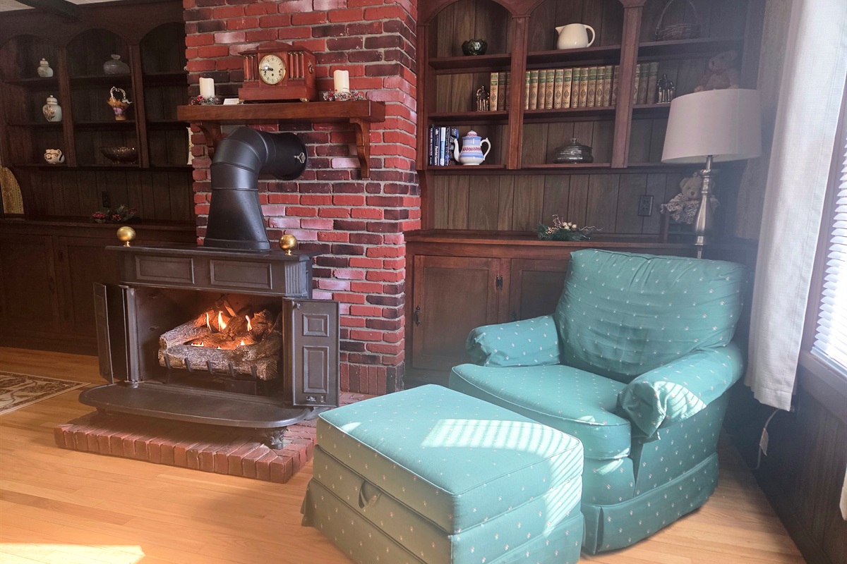 Curl up in the cozy chair and unwind by the fireplace after a day of exploring