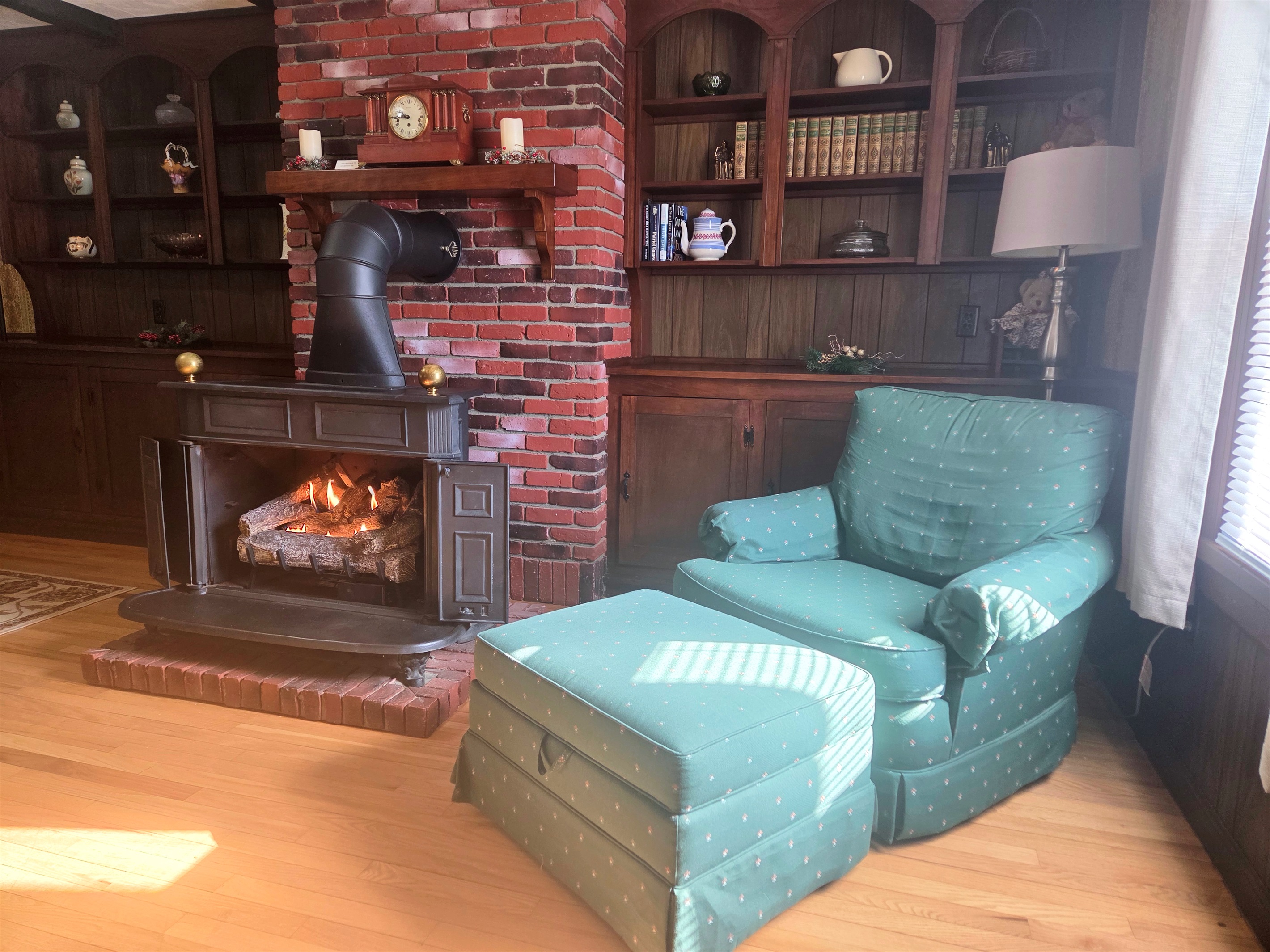 Curl up in the cozy chair and unwind by the fireplace after a day of exploring