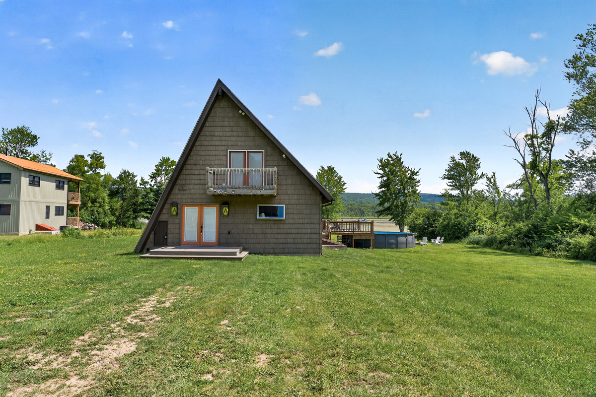 A-frame exterior viewed across the lawn