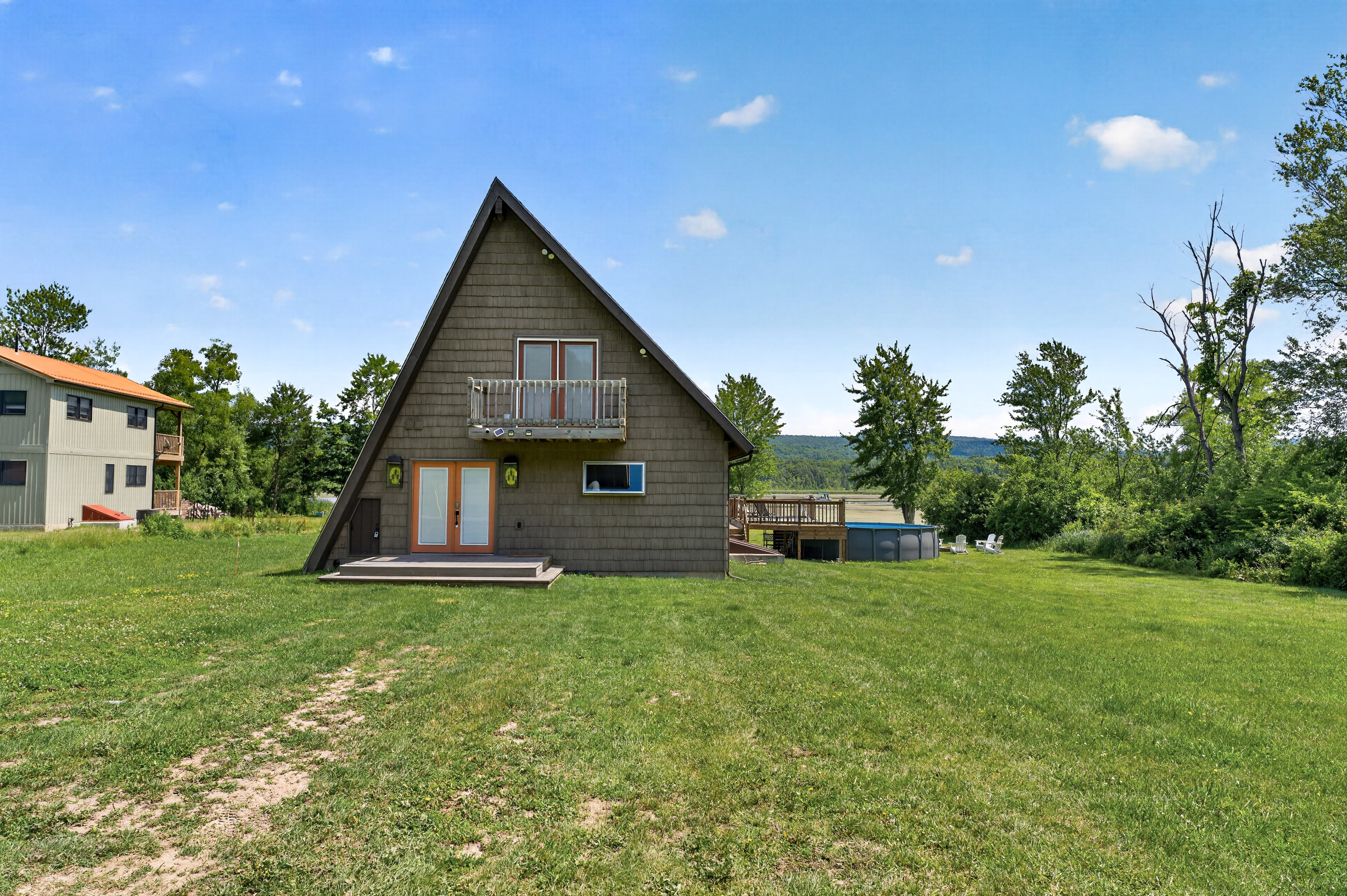 A-frame exterior viewed across the lawn