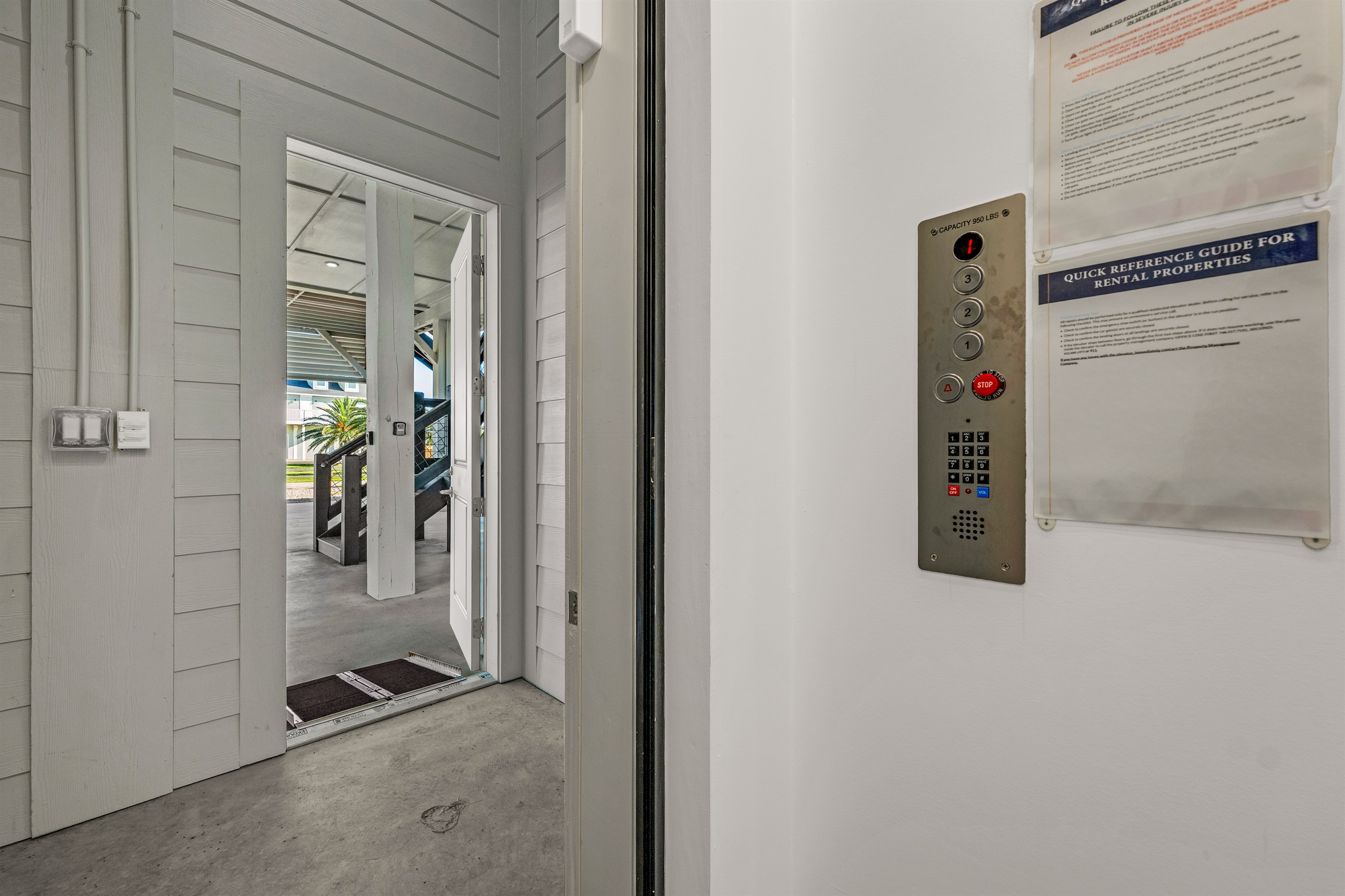 Costa Cristal Elevator: Entrance view from the elevator featuring a clean, well-lit space with a smooth wheelchair-accessible ramp.