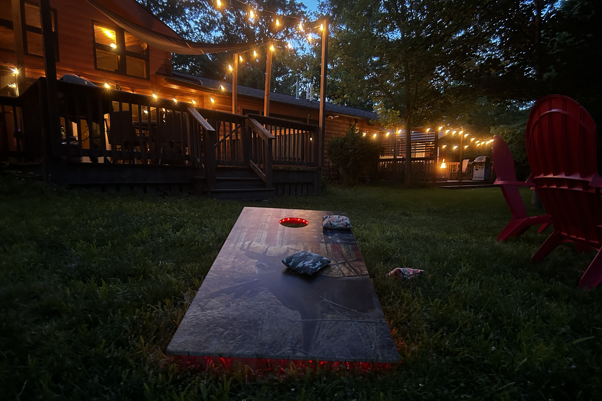 Increase the difficulty level of your corn hole game by playing at night with the LED lights lighting up the boards.