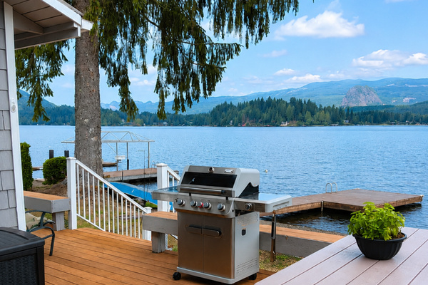 Enjoy the lake views from the deck with comfortable seating, a grill, and plenty of space for outdoor meals and relaxing.