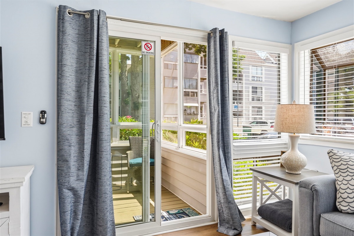 Enjoy sounds of the ocean from the glass enclosed back porch