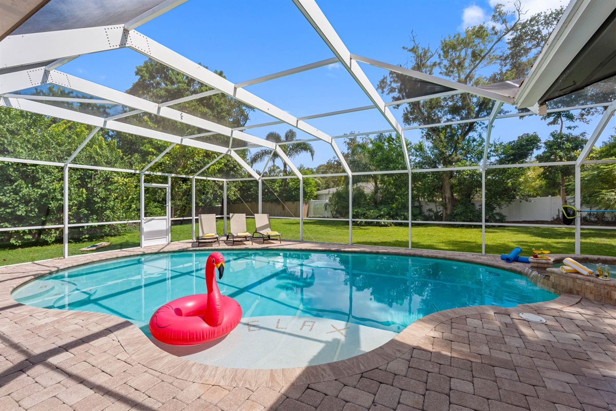 The pool's design seamlessly integrates with the surrounding patio, allowing easy access to lounge areas and outdoor seating.