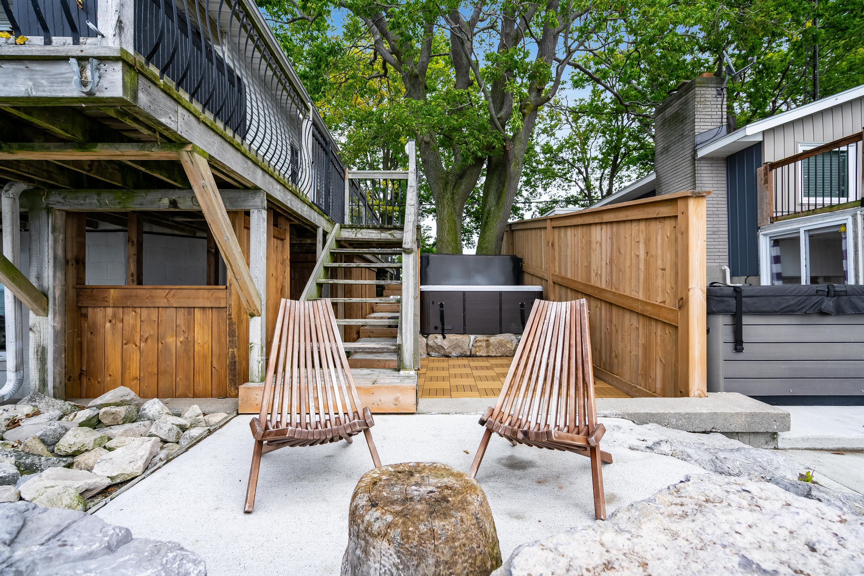 Private outdoor lounge with Adirondack-style seating