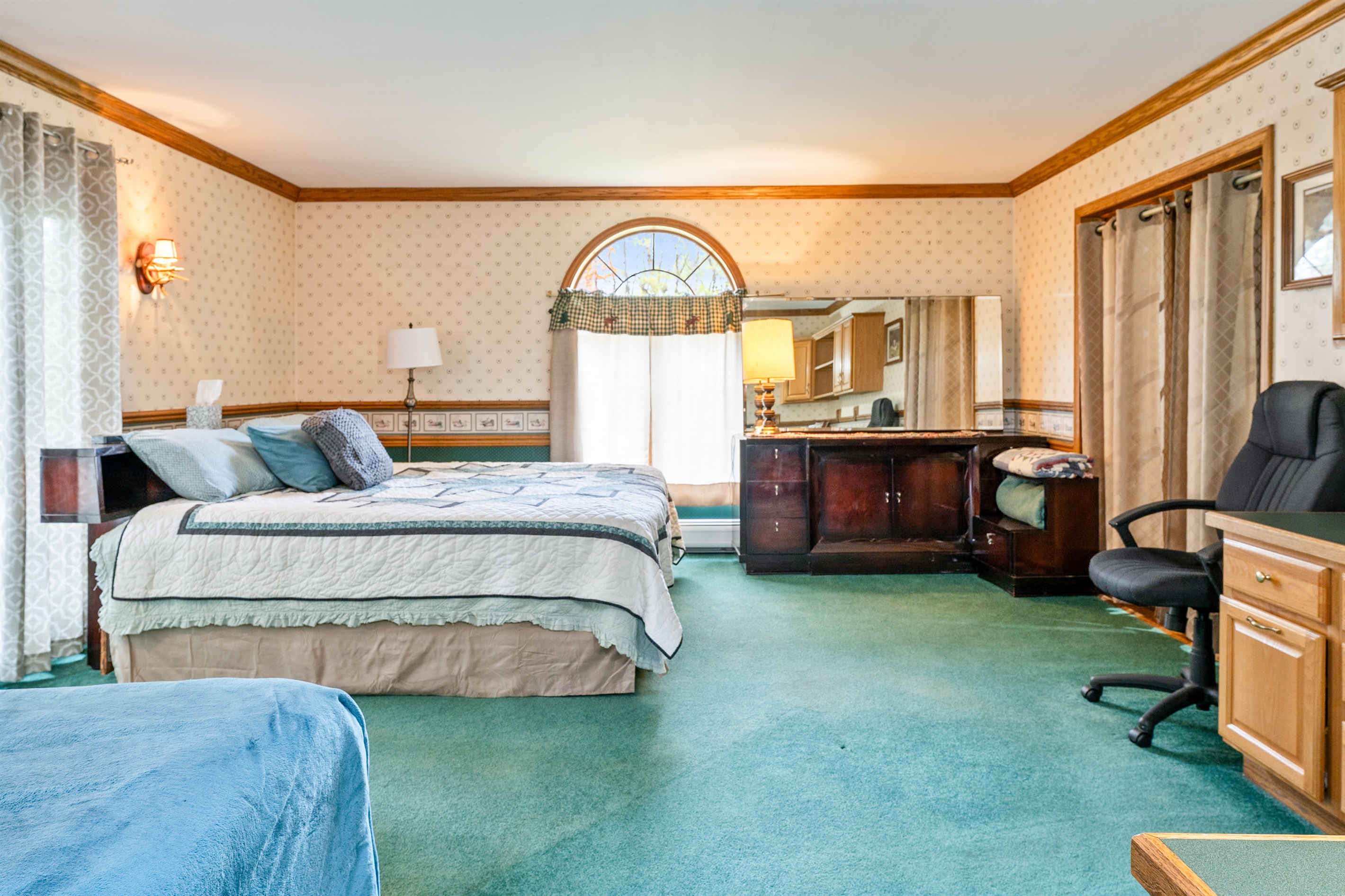 Main floor king bedroom with additional double bed