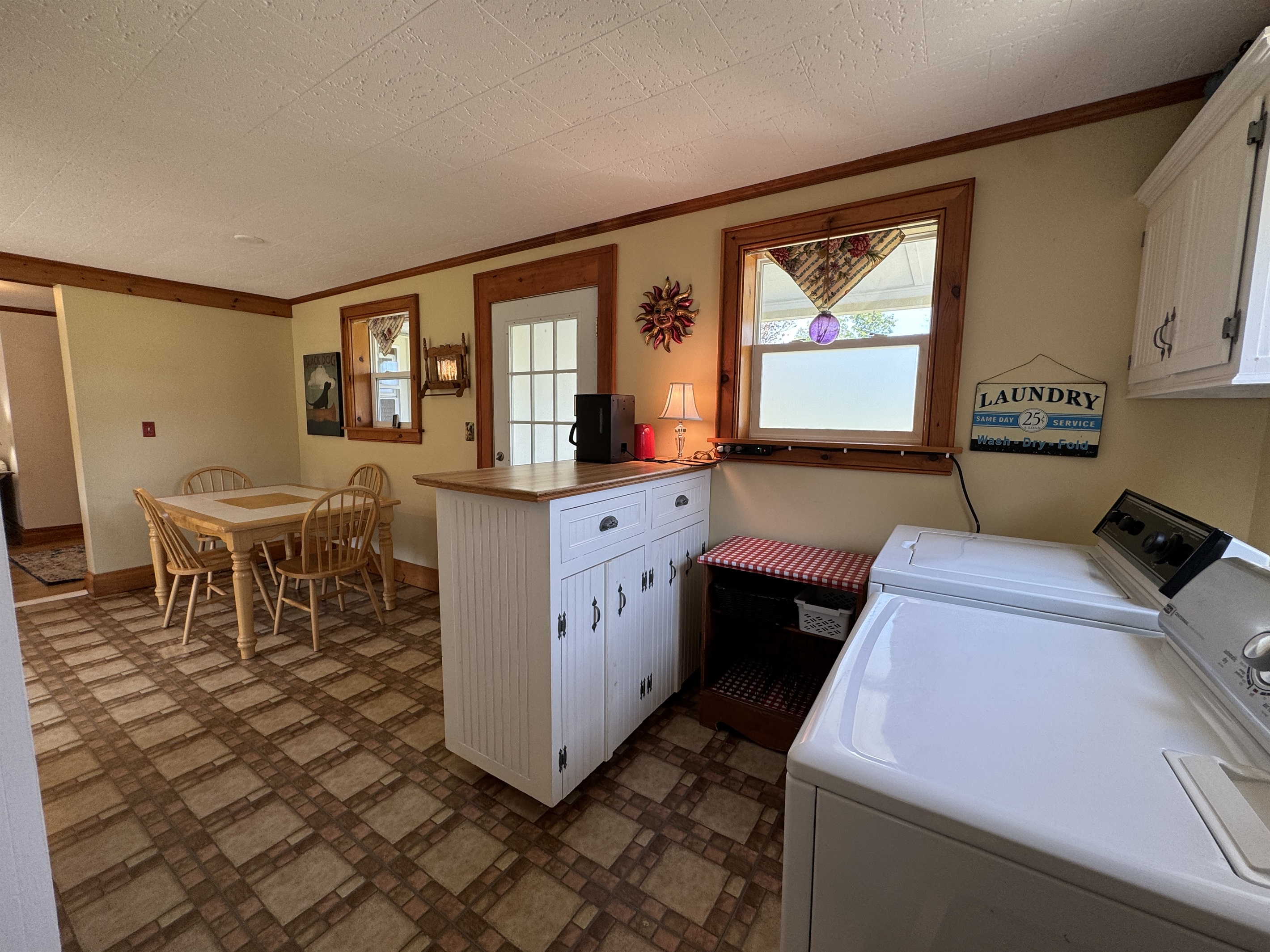 Launrdy area between kitchen and bathroom