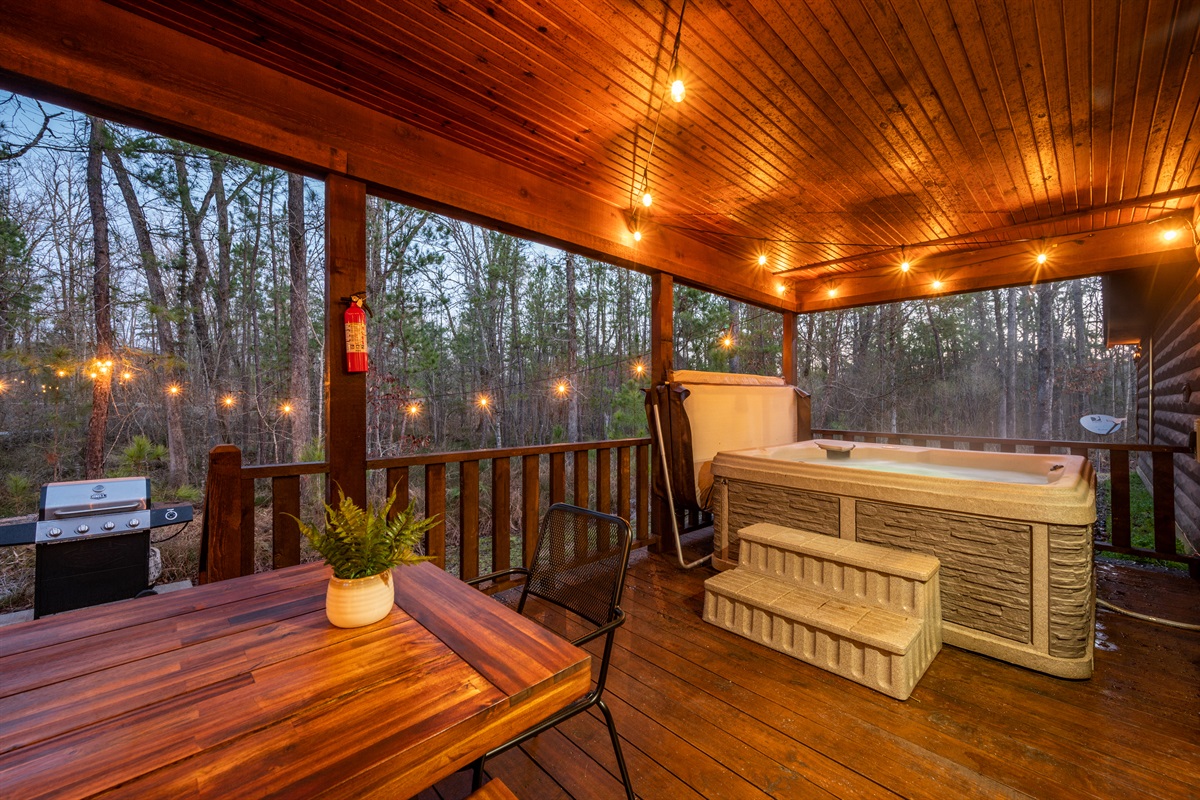 Relaxation awaits! Unwind in our inviting hot tub nestled on a charming patio. Perfect for starlit evenings or sunny afternoons.
