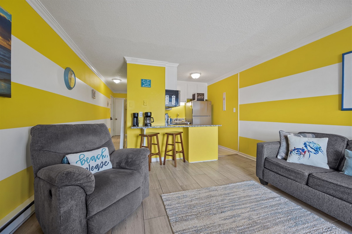 Relax in the recliner after a beach day while the kitchen and bar seating stay close for snacks and drinks