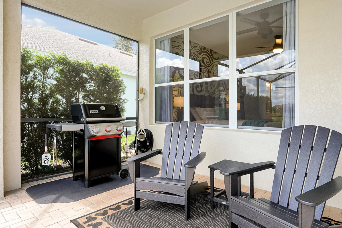 Covered Lanai: Relax in the Adirondack chairs or enjoy a family barbecue beside the private pool.