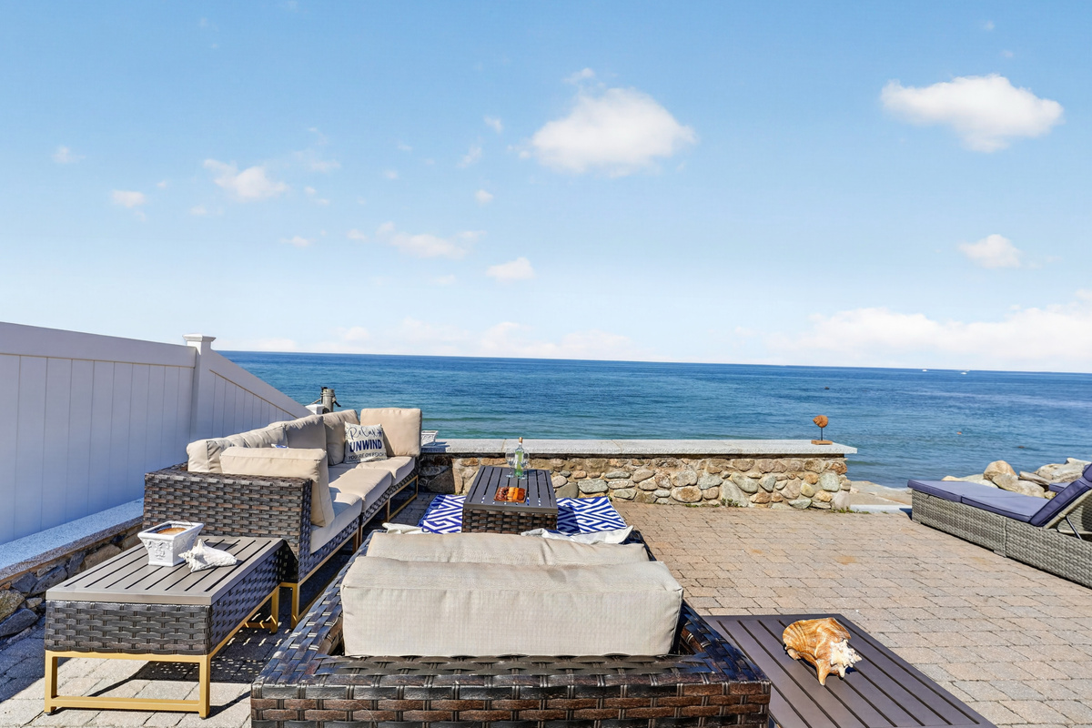 Take in panoramic waterfront views from the home's inviting outdoor living space.